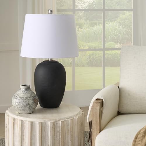 23-inch black distressed ceramic table lamp with tapered white drum shade