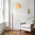 62.5-inch wood arc floor lamp with foot switch, mid-century gold