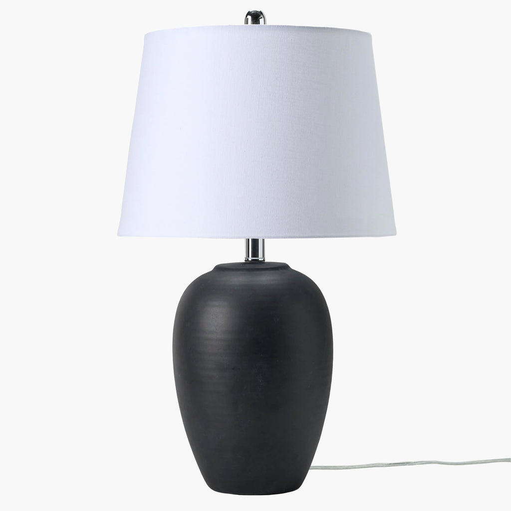 23-inch black distressed ceramic table lamp with tapered white drum shade