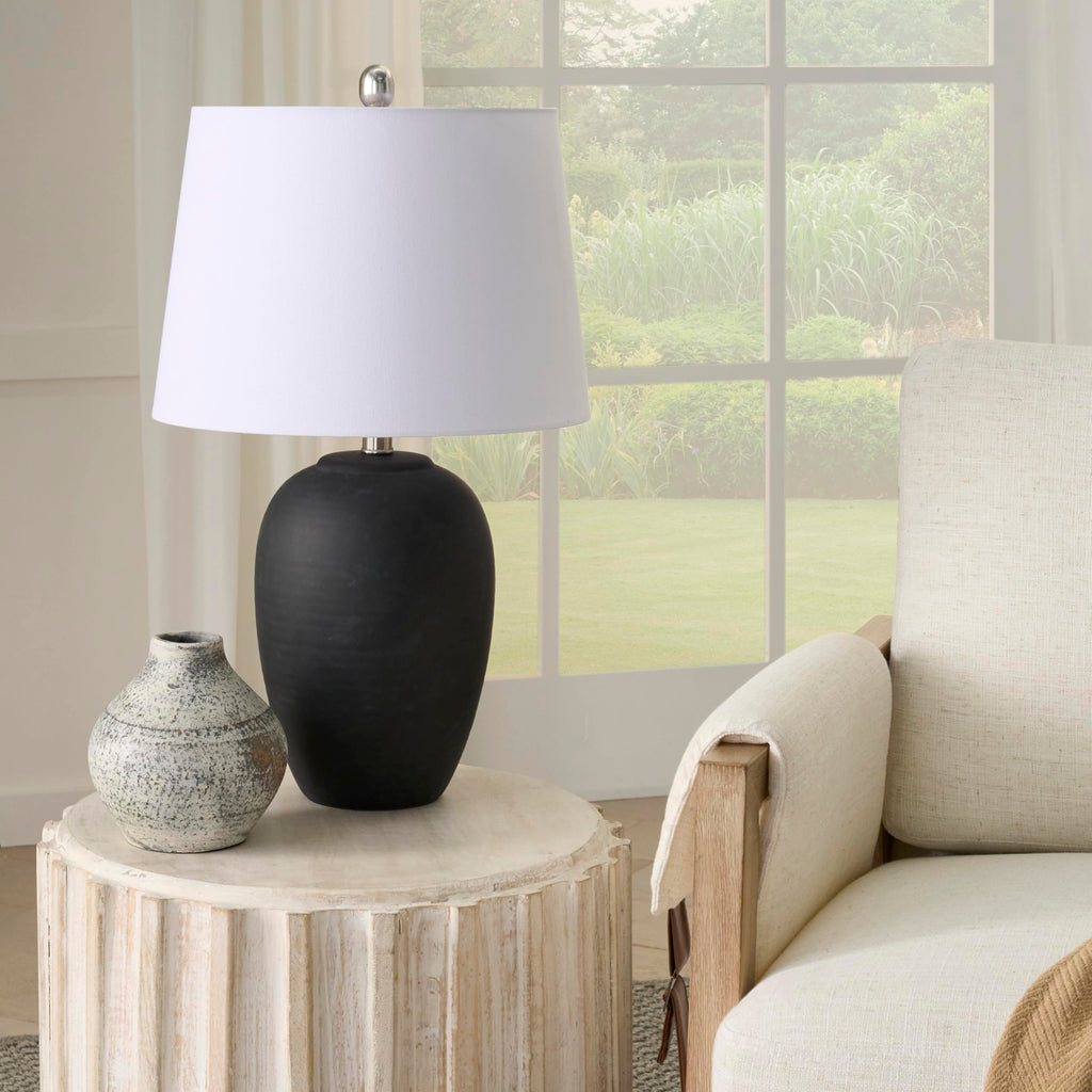 23-inch black distressed ceramic table lamp with tapered white drum shade